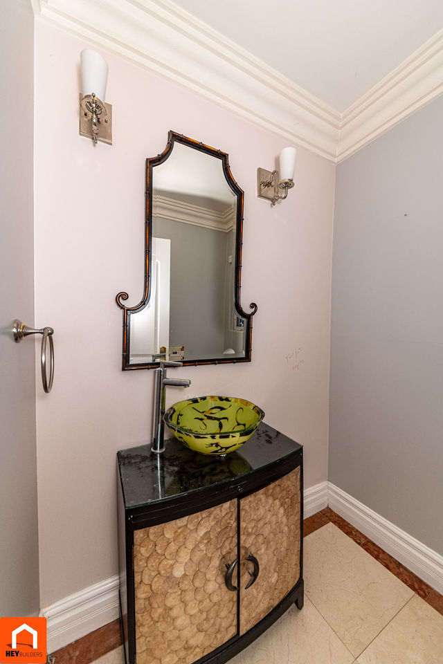 Powder room vanity before renovation - decorative vessel sink