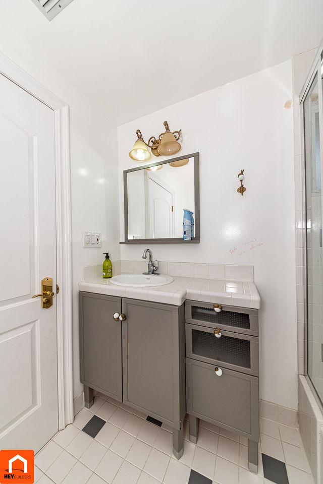 Secondary bathroom vanity before renovation
