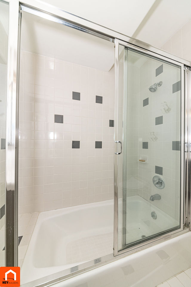 Secondary bathroom tub and shower before renovation